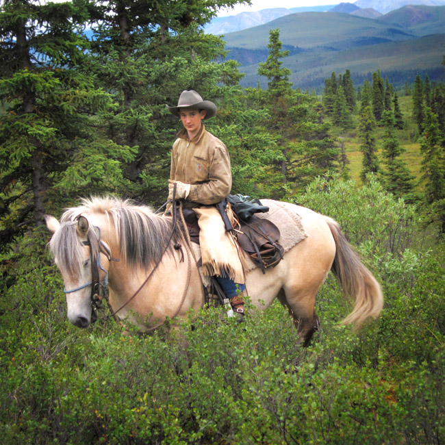 Daniel our riding the range on his horse dusty.